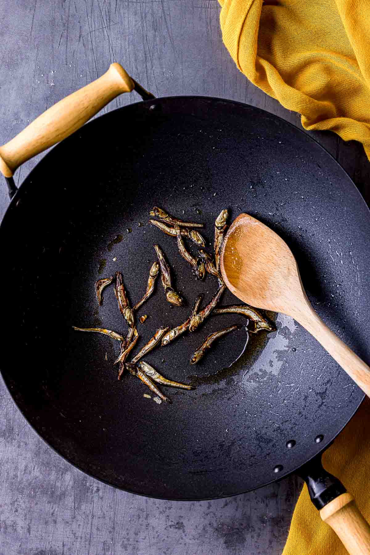 anchovies frying in a wok