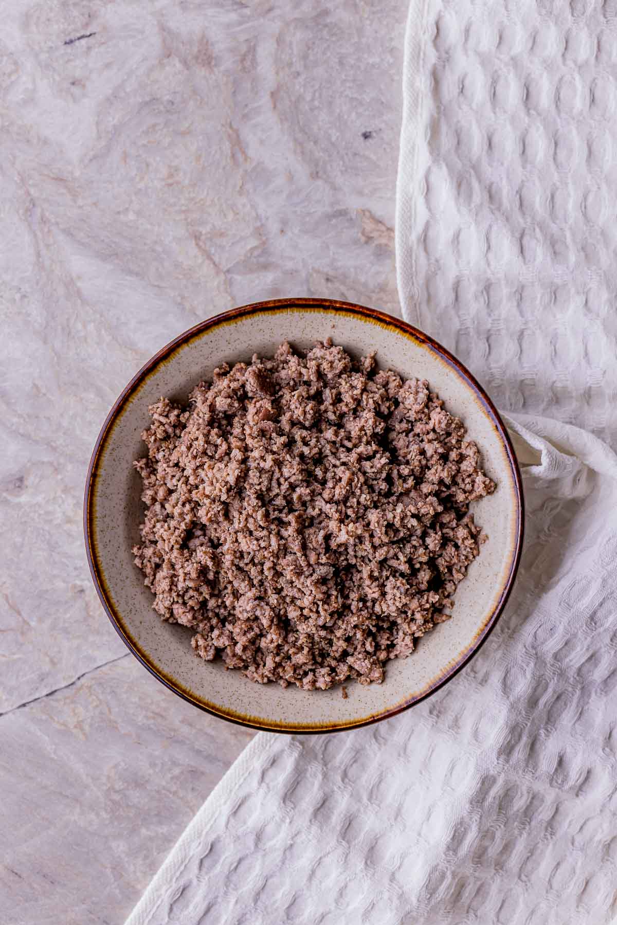 Browned ground beef in a pan