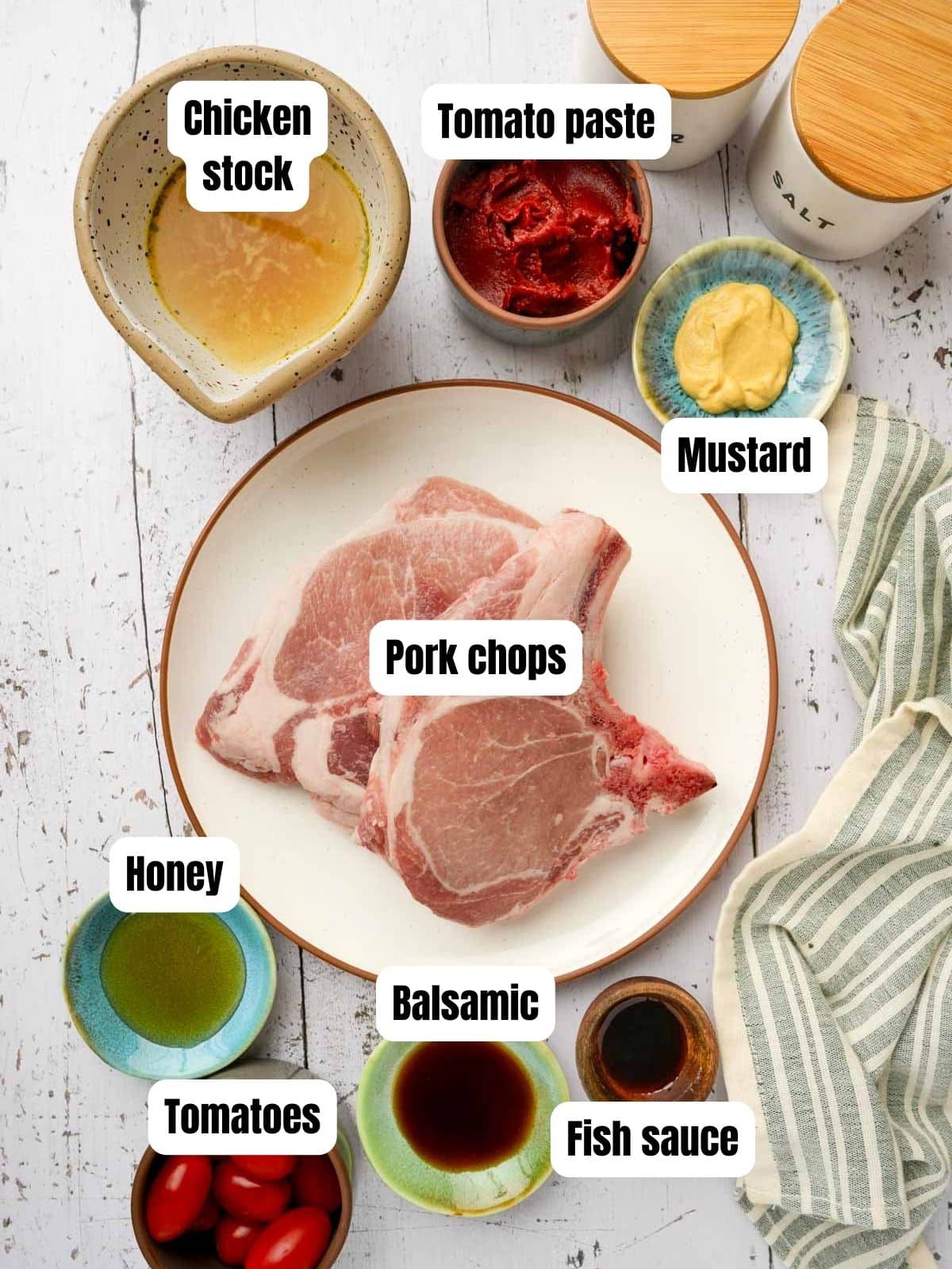 ingredients for sous vide bone in pork chops on a table with text overlay