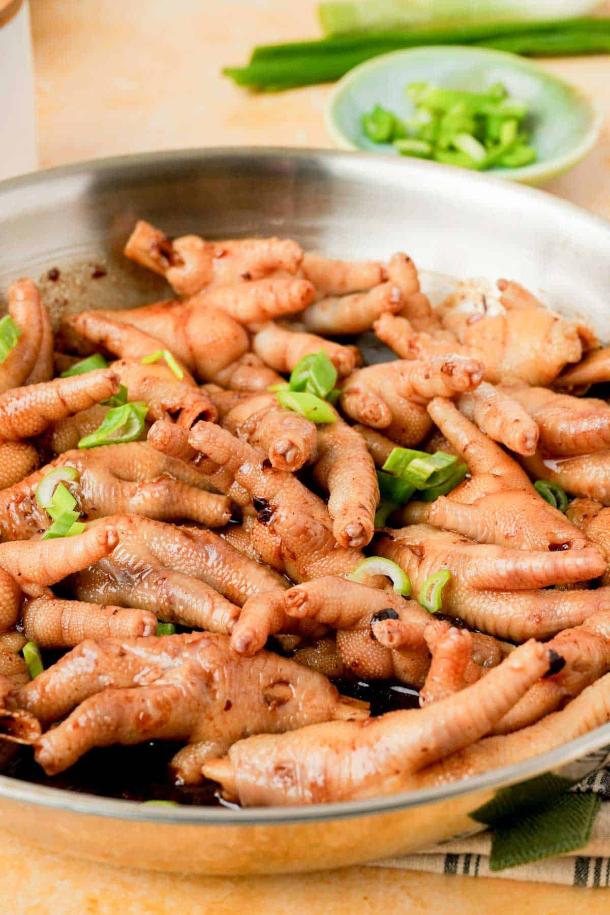 cooked chicken feet in a pan