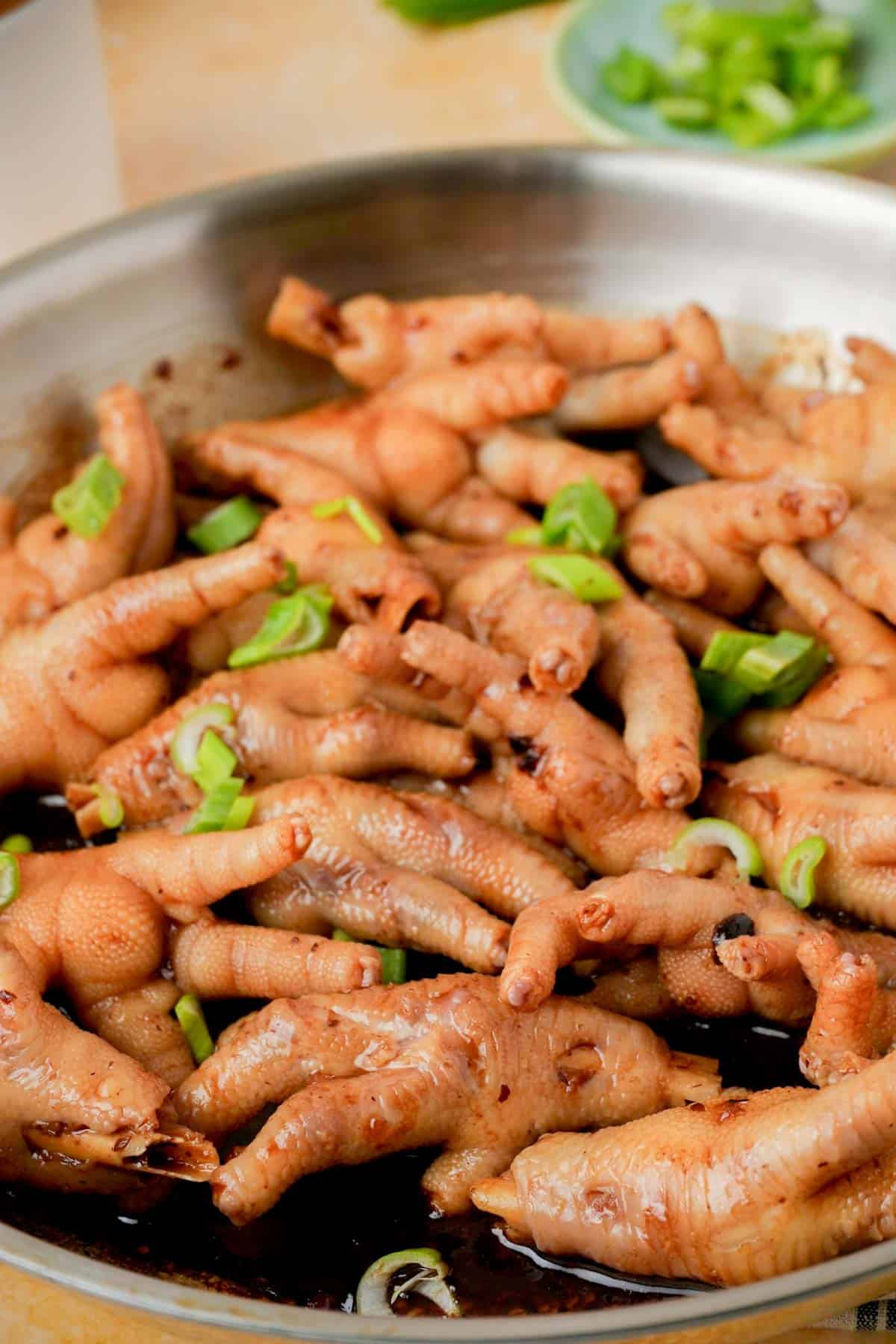 cooked chicken feet in a skillet