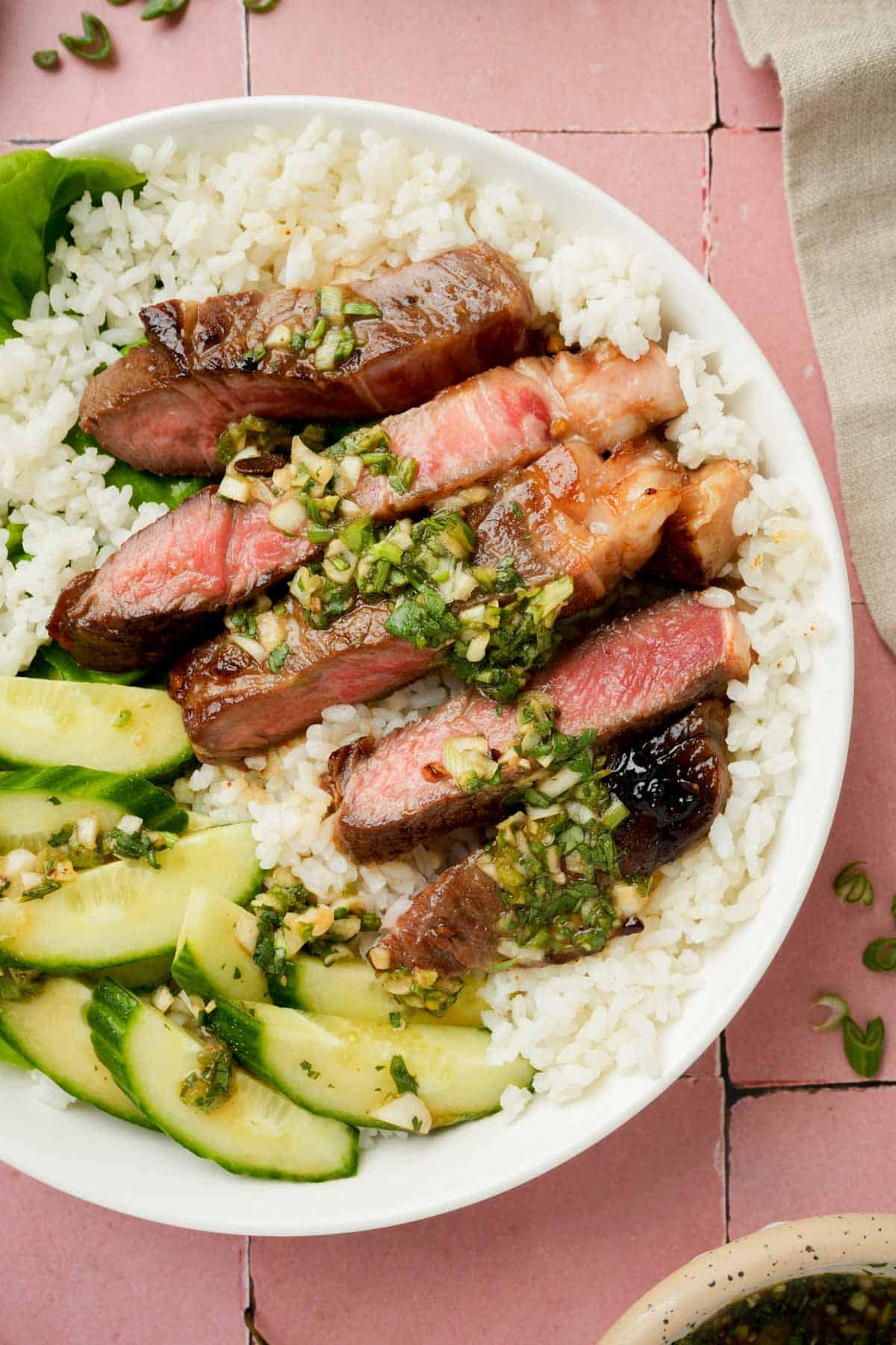 beef slices in a green sauce over rice