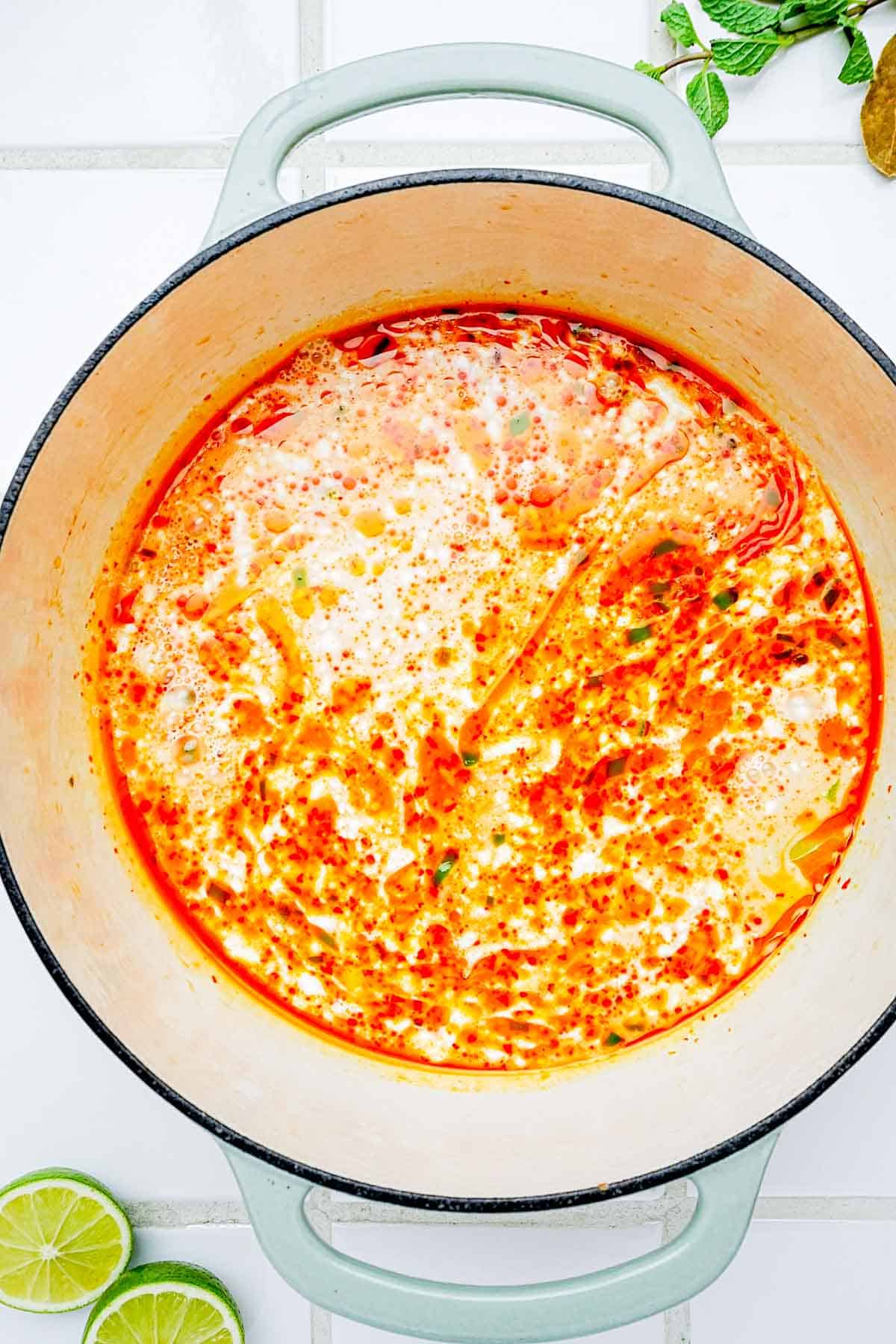 red and creamy sauce in a pot.