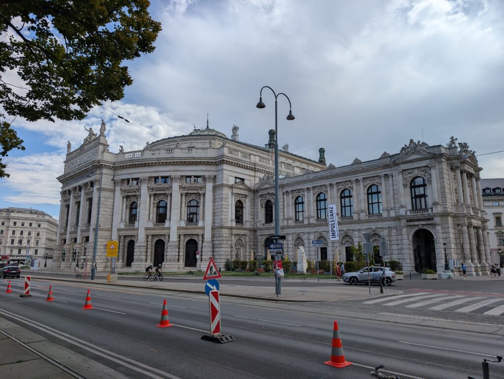 The image shows the historic Burgtheater (Austrian National Theatre) located on the Universitätsring in Vienna, Austria. Originally opened in 1741 under Empress Maria Theresa, this current magnificent Renaissance Revival building opened in 1888. It is the Austrian national theatre and widely considered one of the most important German-language stage venues in the world.
