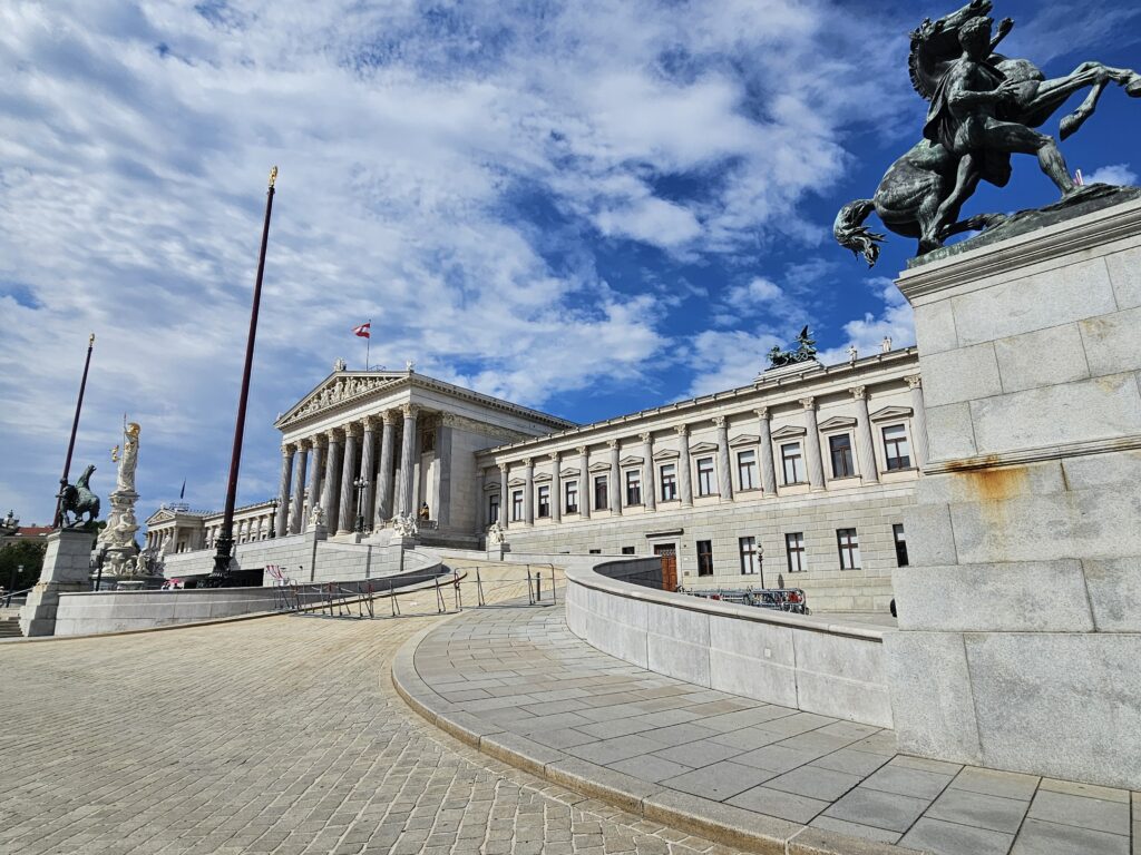 Austrian Parliament Building (Parlamentsgebäude) located on the Ringstraße was built in the neo-classical style and completed in 1883, it serves as the seat of the two houses of the Austrian Parliament and is a beautiful building.