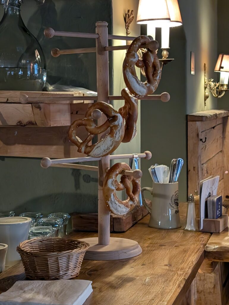 Austrian pretzels (Brezen or Brezel) are soft, twisted baked pastries with a deep brown crust and a soft, chewy interior during Salzburg Day Trip from Vienna