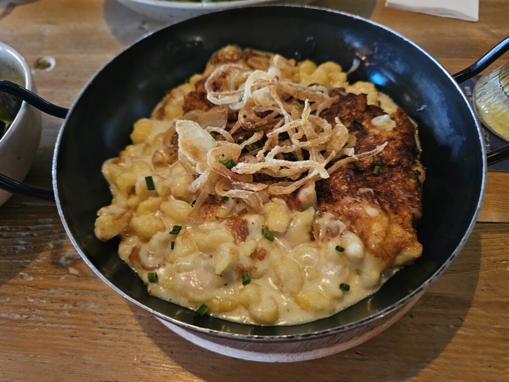 Käsespätzle, homemade cheese spaetzle topped with crispy onions.