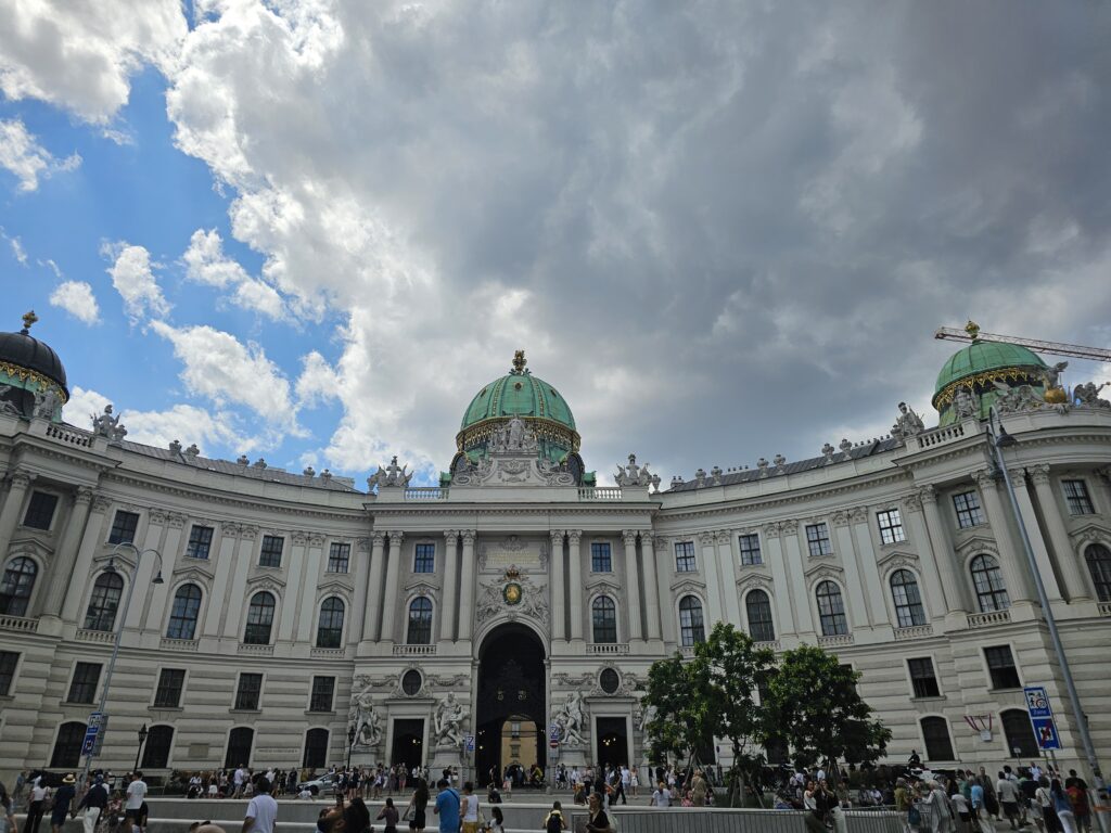 Michaelertrakt (St. Michael's Wing) of the Hofburg Palace facing Michaelerplatz. This area Serves as a grand monumental entrance to the historic imperial palace complex and connects the Winter Riding School with the Imperial Chancellery Wing.