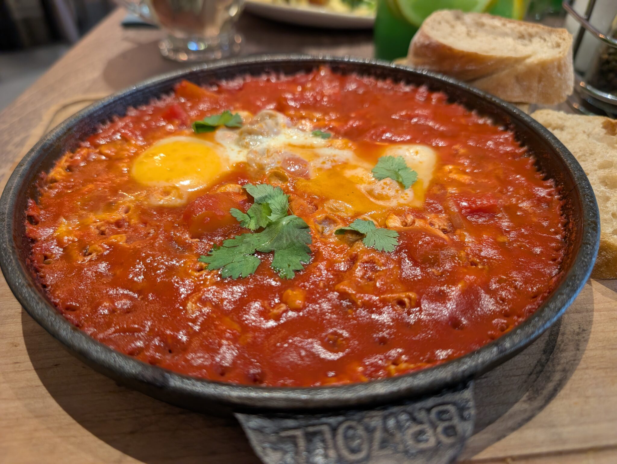 Shakshuka is a flavorful dish of eggs gently cooked in a rich, spiced tomato and pepper sauce. Traditionally associated with North African and Middle Eastern cuisine, it has become a popular breakfast and brunch dish throughout Central Europe. The eggs are usually cooked right in the sauce, with herbs and spices adding plenty of flavor, and it's perfect served with crusty bread for soaking up every last bit.
We were a little surprised to find shakshuka on breakfast menus in Krakow, but that's part of what makes traveling through food so much fun. You never know when a dish from another part of the world will become a local favorite.