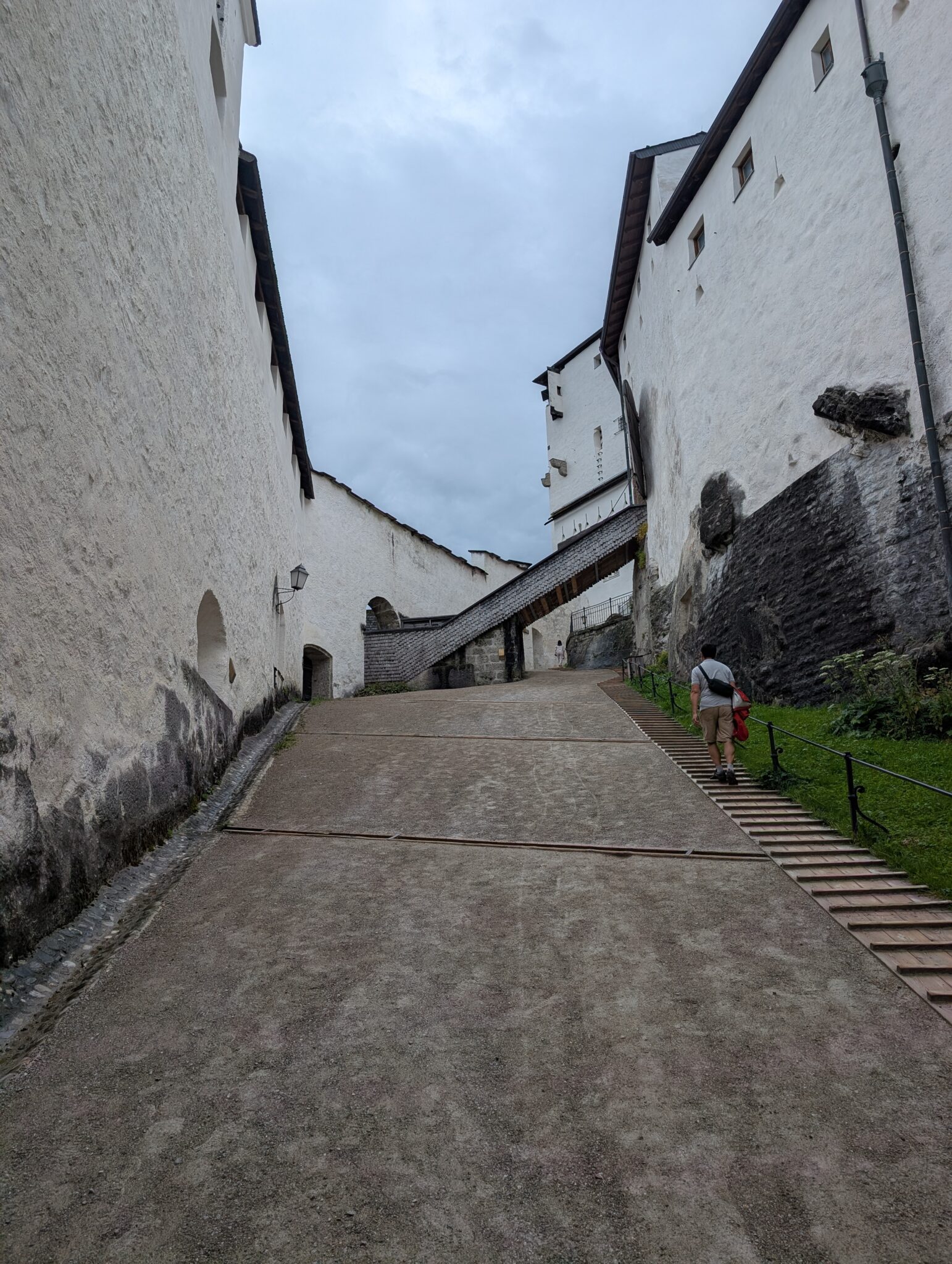 This steep, paved walking path is one of the main pedestrian routes up to the castle grounds for visitors who choose to hike rather than take the funicular railway.
