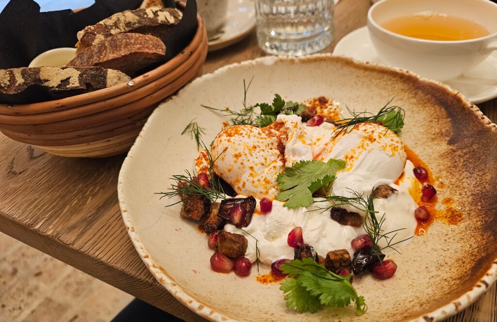Turkish eggs, two perfectly poached eggs served over creamy garlic labneh with tender aubergine, juicy pomegranate seeds, browned butter, fresh coriander and mint. The rich, buttery flavors were balanced by the tangy labneh, bright pomegranate and fresh herbs, while warm bread and butter made the perfect vehicle for scooping up every last bite.