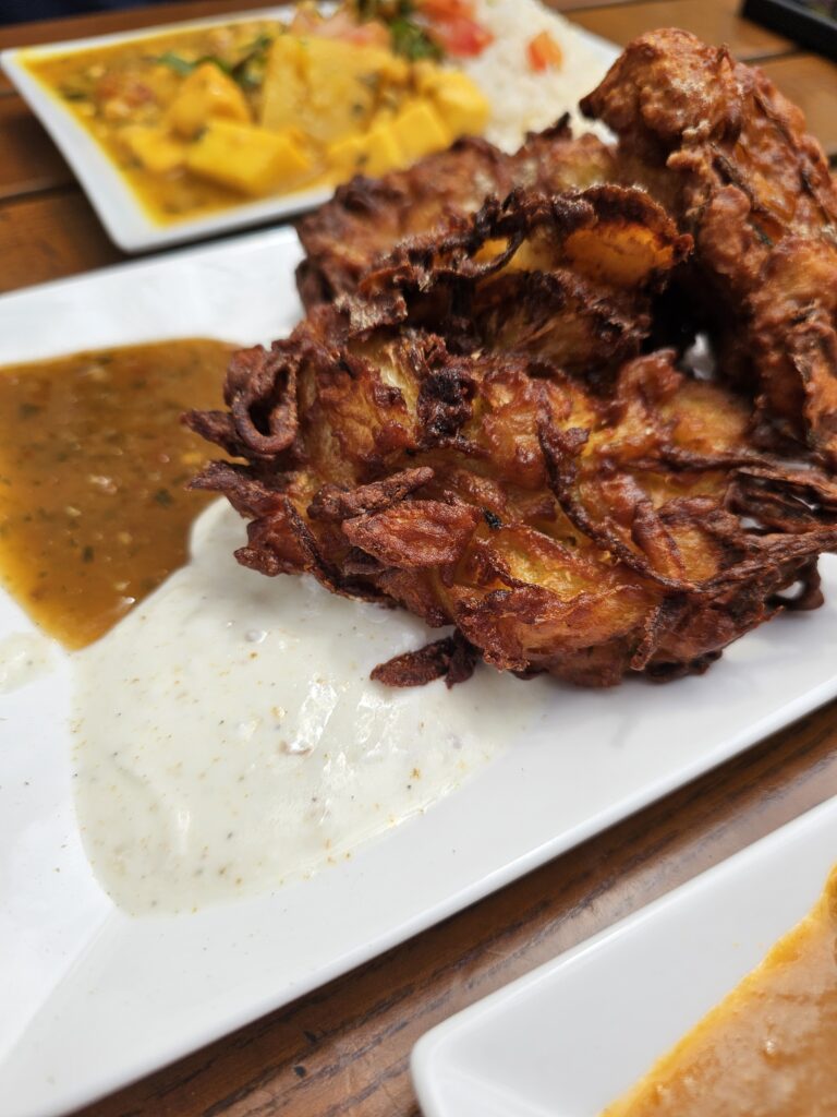 Freshly fried, crispy onion bhaji, an Indian spiced onion fritter.