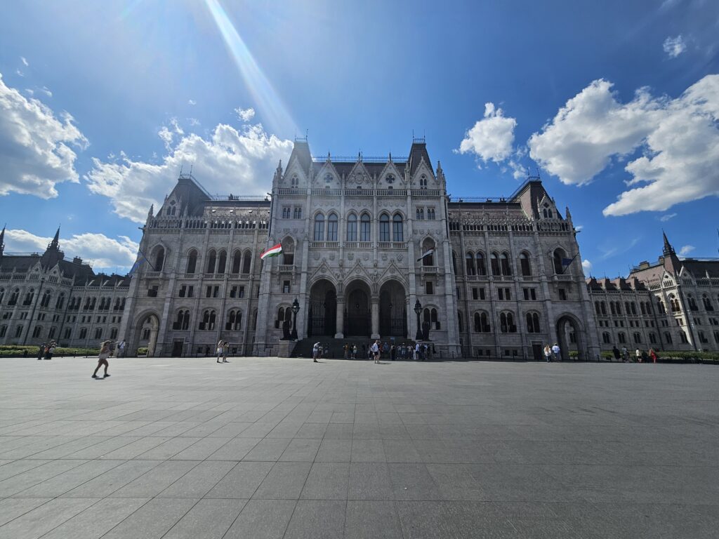 Kossuth Lajos Square offers one of the best views of the Hungarian Parliament Building. This spacious pedestrian-only square provides the perfect vantage point to admire the building's stunning Neo-Gothic architecture, with its intricate stonework, soaring spires, and ornate façade overlooking the Danube River.