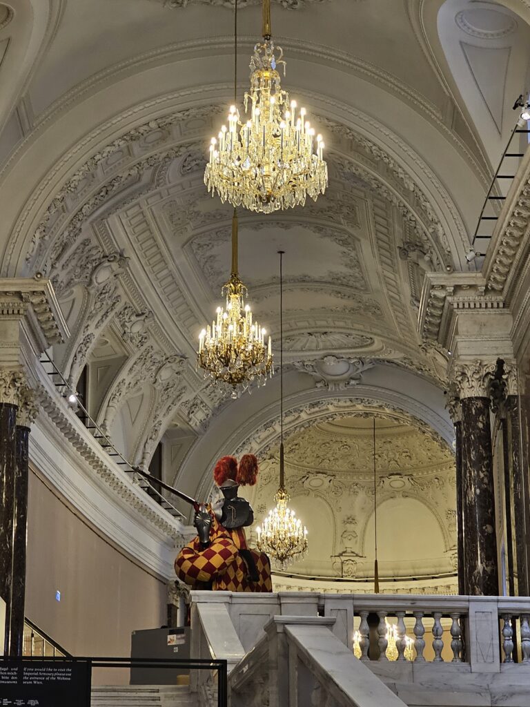 The grand interior of the Neue Burg wing within the Hofburg Palace complex.