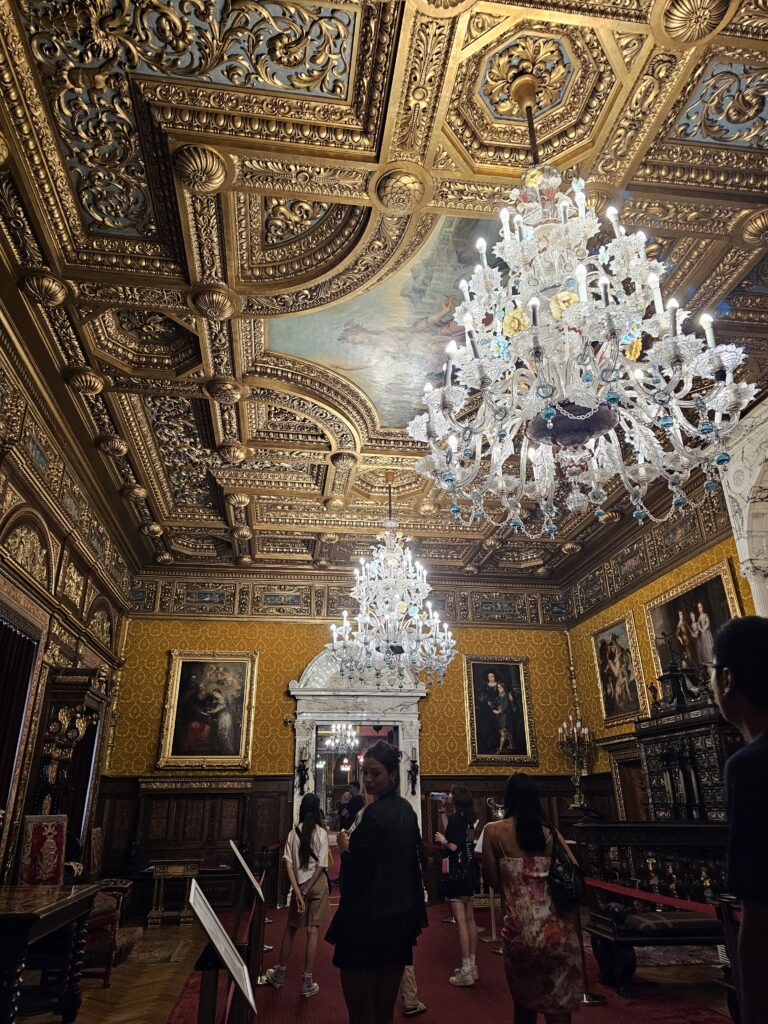 The Florentine room features an intricate, hand-carved wooden ceiling covered in gold leaf. The large Murano Chandeliers, hanging from the center arecrafted from famous Italian Murano glass.