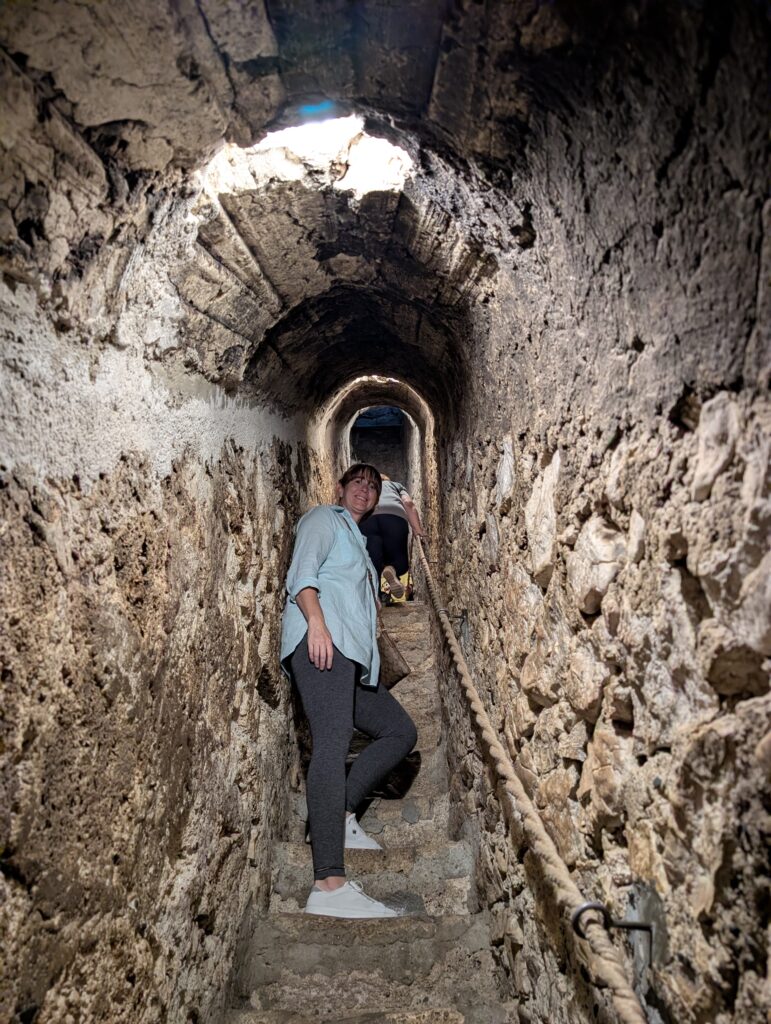 Here I am making my way up one of the narrow stone staircases hidden inside Bran Castle