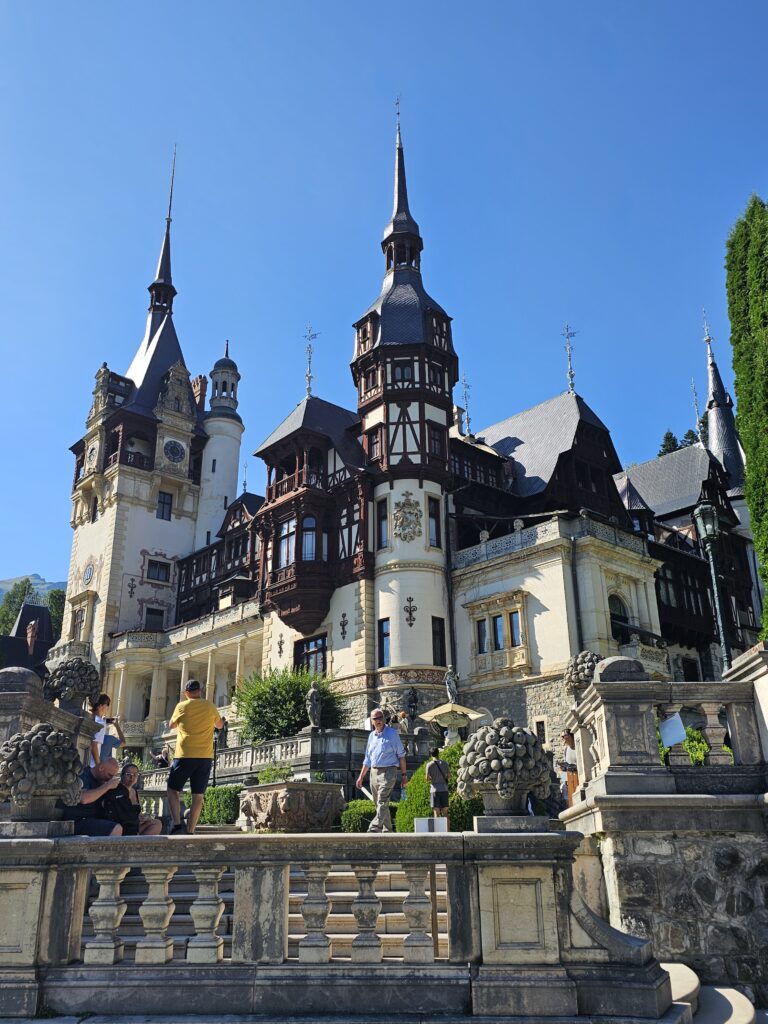The ornate facade of PeleÈ™ Castle, a Neo-Renaissance royal palace located in Sinaia, Romania