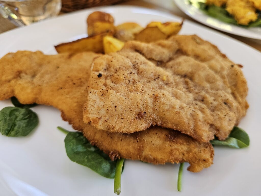 What I Ate in Romania: The chicken schnitzel was tender and juicy on the inside with a golden, crispy coating on the outside. It was lightly seasoned, letting the chicken shine without being overly heavy. The crunchy breading made every bite satisfying