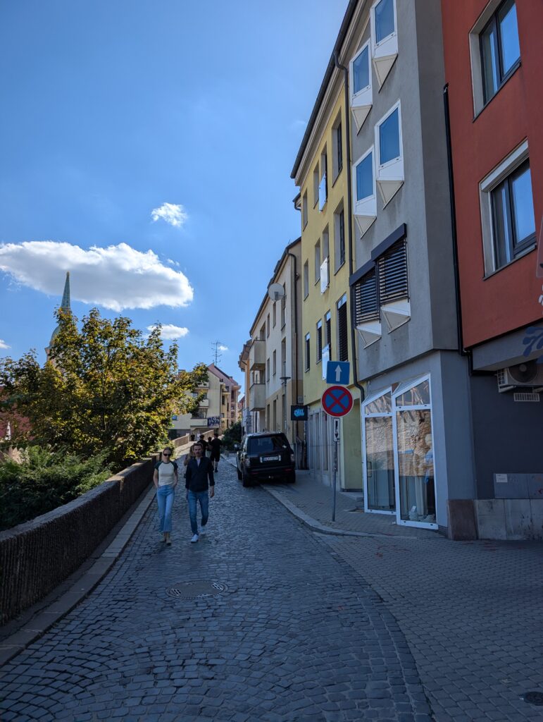 The narrow cobblestone streets of Old Town Bratislava wind upwards toward Bratislava Castle, offering scenic views of old town