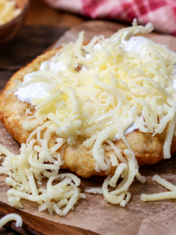 Traditional sour cream and cheese Langos
